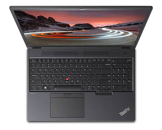Aerial view of Lenovo ThinkPad P16v (16” Intel) mobile workstation, opened, showing full keyboard & display with Windows 11 start-up screen with a mountain image