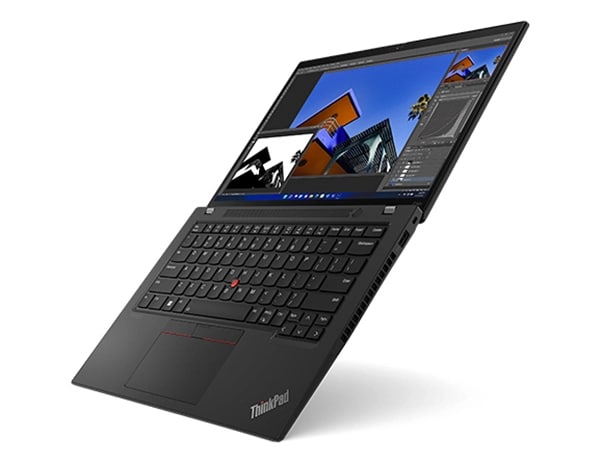 Lenovo ThinkPad P14s Gen 4 (14” AMD) mobile workstation, opened flat at a 45 degree angle, showing keyboard & display with house images on screen