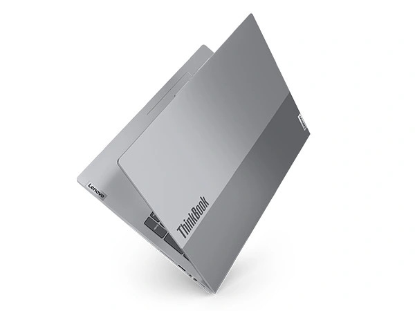 Lenovo ThinkBook 16 Gen 6 laptop with cover nearly closed& facing upright, as if on the binding like a book.