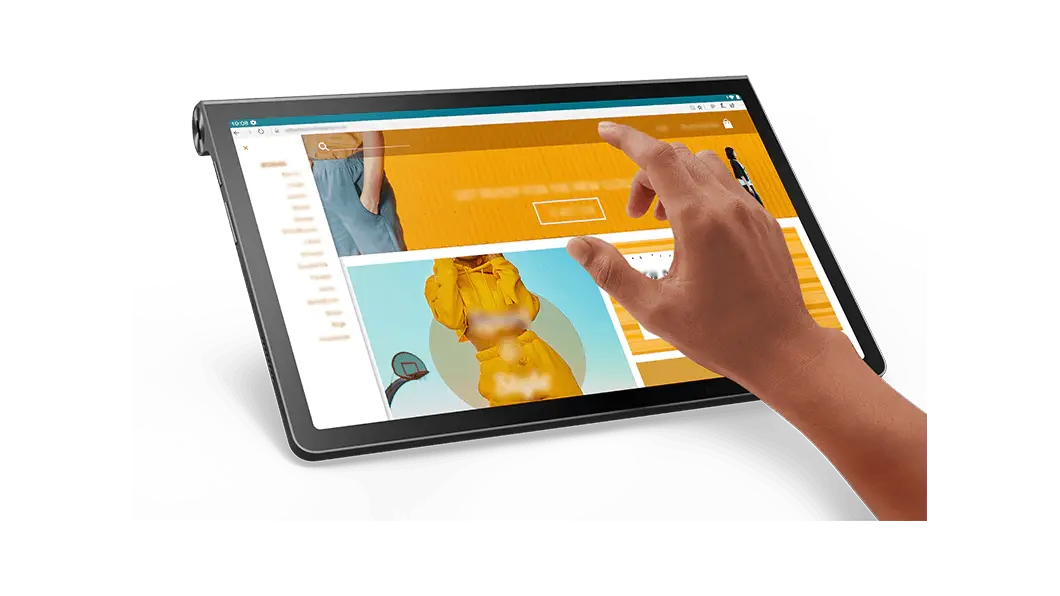 Tablet Lenovo Yoga Tab 11: vista frontal izquierda ¾ con un catálogo de ropa en línea en la pantalla y la mano derecha de una persona a punto de tocar una selección