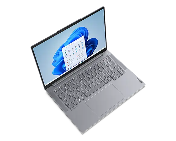 Aerial view of Lenovo ThinkBook 14 Gen 6+ (14 inch Intel) laptop, opened at slight angle, showing 14 inch display, keyboard & trackpad