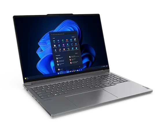 Front, left side view of the Lenovo ThinkBook 16p Gen 5 (16” Intel) laptop with lid opened at a wide angle, focusing keyboard & a Windows 11 Pro menu on the screen.