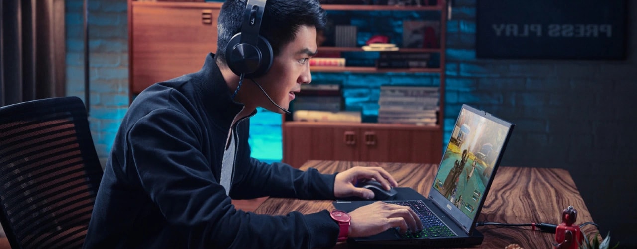 Lenovo Legion 7i Gen 9 (16″ Intel) being used by a male sitting at a table