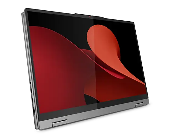 Vy framifrån från vänster sida av den bärbara datorn Lenovo IdeaPad 5 2-i-1 Gen 9 (16" AMD) i surfplatteläge i Luna Grey, med fokus på skärmen som särskiljer en normal skärm och en OLED-skärm av en bakgrundsbild.
