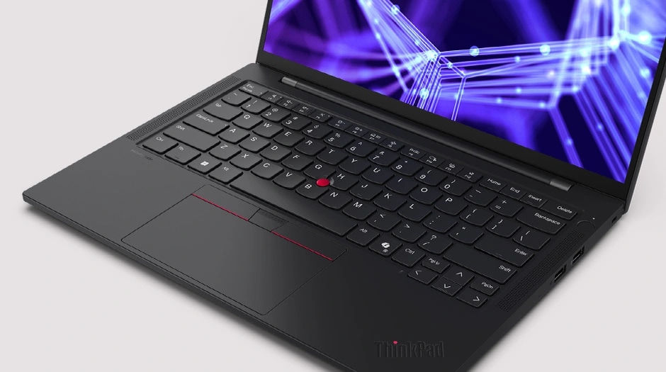 Cropped image of the Lenovo ThinkPad T14s Gen 6 laptop, focusing on the ThinkPad logo in the lower right corner of the keyboard.