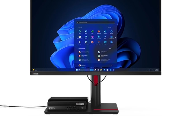 Lenovo ThinkCentre Tiny-in-One Monitor von vorne mit dem Lenovo ThinkCentre M70q Gen 5 Tiny PC, der an der Vesa-Halterung im Sockel des Displays angebracht ist.