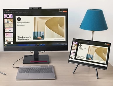 A view showing Lenovo ThinkBook Plus Gen 5 Hybrid (14” Intel) Tablet placed on the sturdy Lenovo Universal Easel Stand & Hybrid Station linked to an external monitor to multitask & increase productivity.