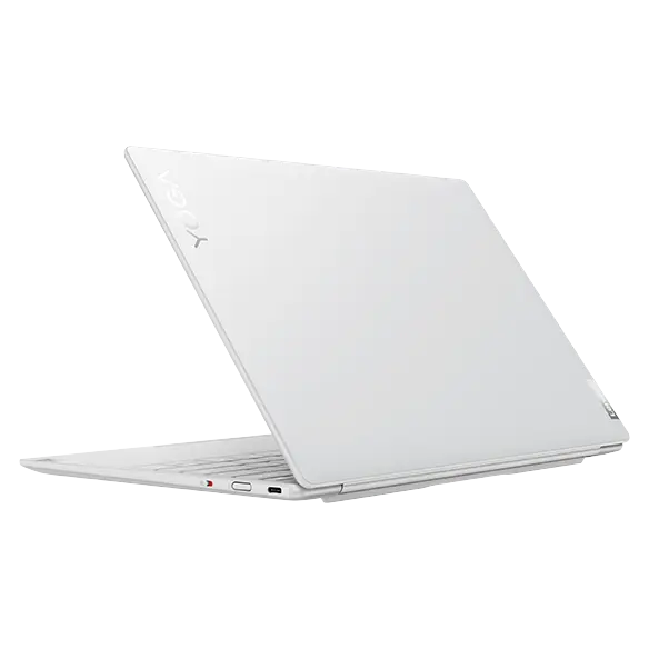 Rear-facing Yoga Slim 7i Carbon laptop, at an angle., opened 45 degrees, showing rear cover, part of cover, and right-side ports