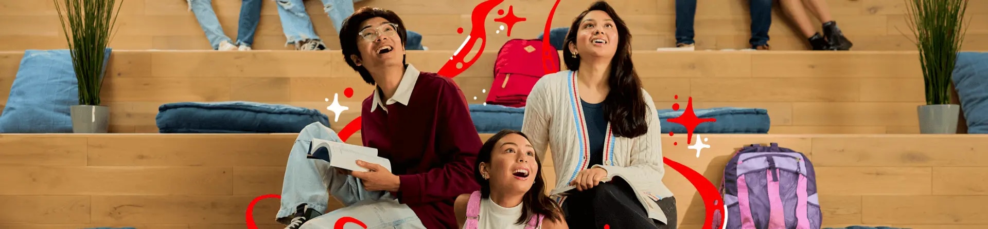 Three young people sitting on cushions on step-style wooden bleacher seats, one using a Lenovo laptop, one reading a book, all looking upward with red wavy graphics superimposed.