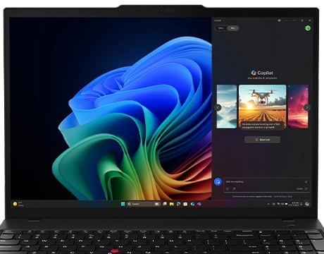 Lenovo ThinkPad T16 Gen 4 (16" Intel) laptop – close-up front view, lid open with Copilot menu against multicolored Windows Bloom background on the display 