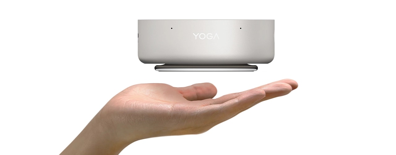 A compact Lenovo Yoga Mini i Gen 11 (Intel) PC balances on an open palm, showcasing its portability & lightweight design.