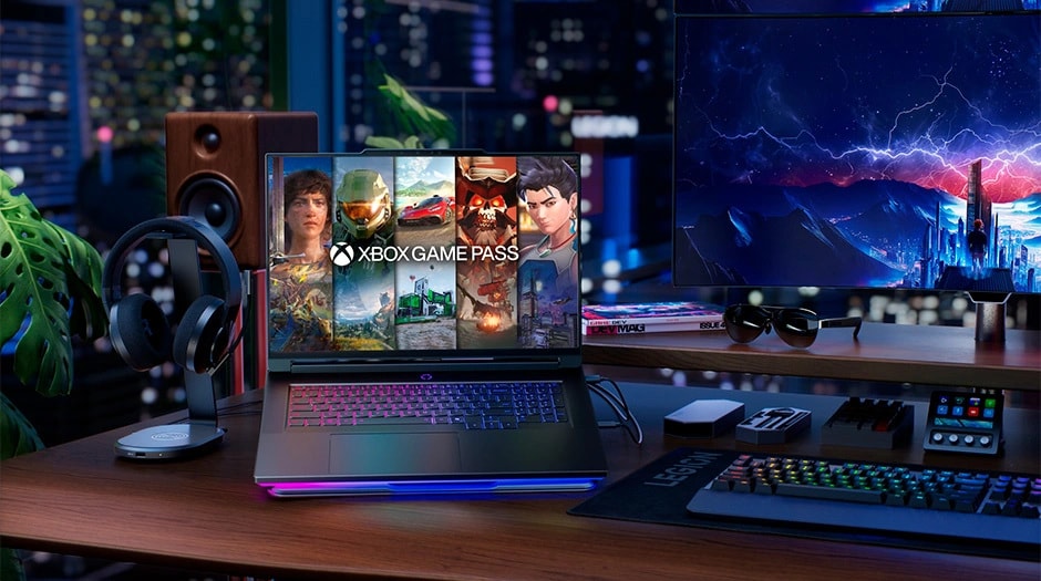 Laptop displaying Xbox Game Pass with various game covers in a modern room. Lenovo Legion 9i Gen 10. מחשב נייד Legion 9 18IAX10 83EY001GIV מבית Lenovo