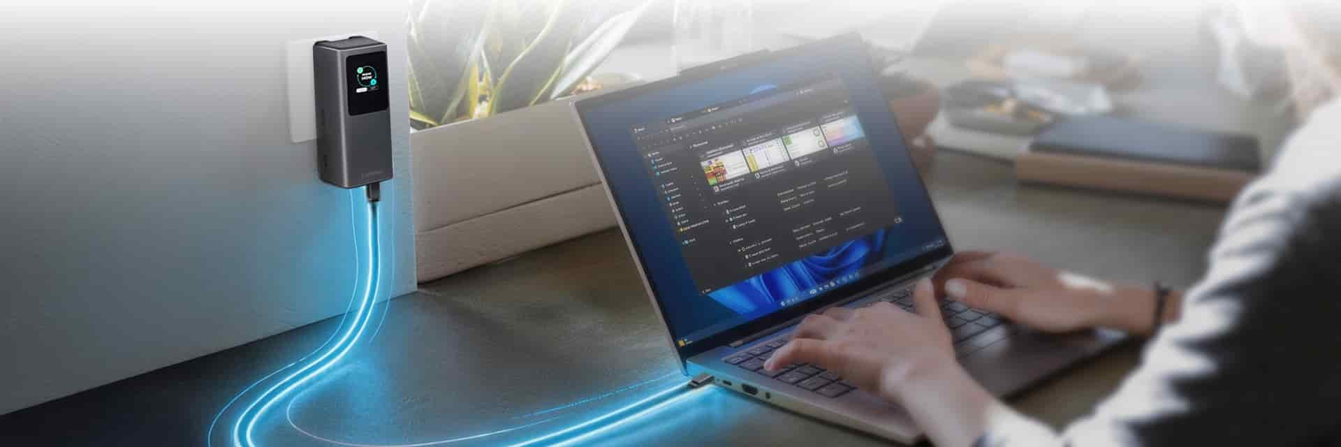 A laptop plugged into a wall charger with a glowing power line effect.