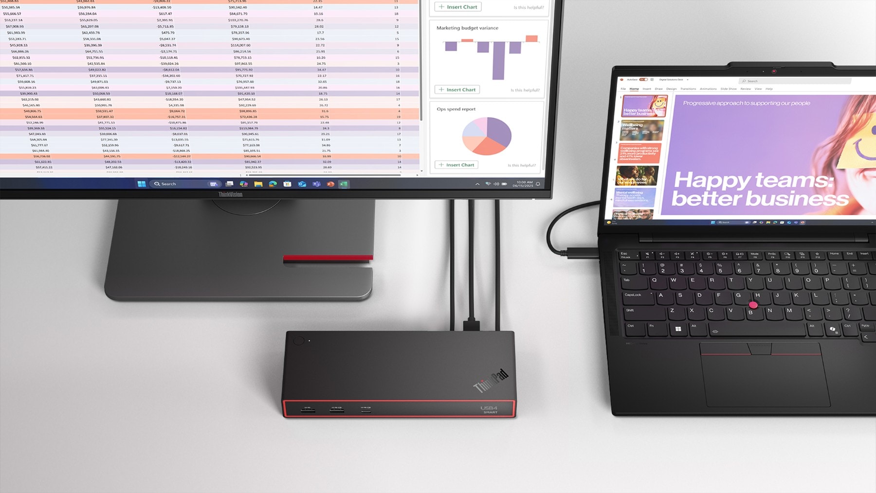 A laptop placed on top of a desktop computer, showcasing both devices in a modern workspace setting.