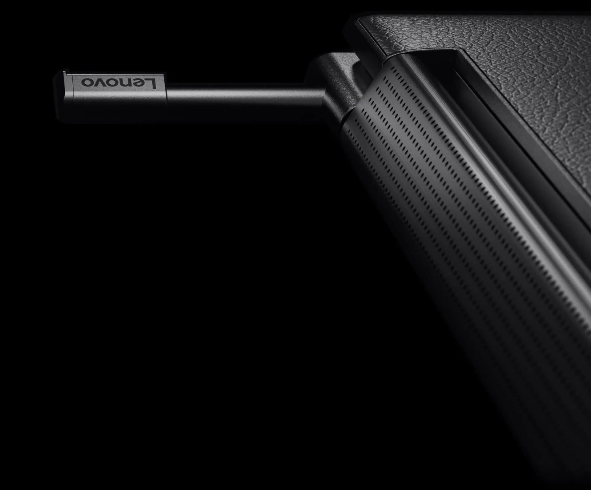 Cropped closeup of the sound bar near the hinge of a Yoga 2-in-1, with a stylus protruding from its garage 