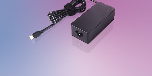 A Lenovo USB-C 65W Standard AC Adapter is featured on a background.