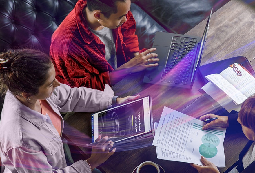 Lenovo ThinkPad X1 Yoga Gen 8 2-in-1 laptop in tent mode next to a wireless keyboard, being used with the integrated pen.