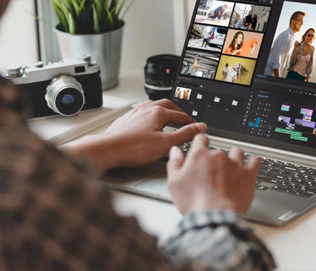 A person using a lenovo laptop for photo editing