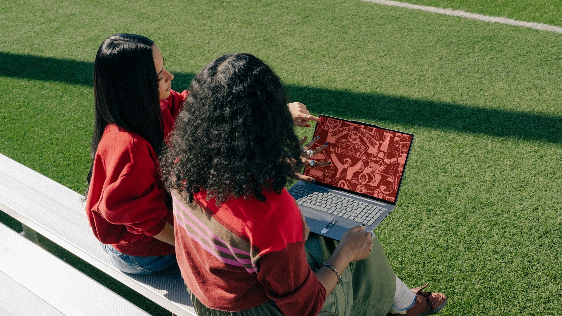 Sophia and club players with a Lenovo laptop
