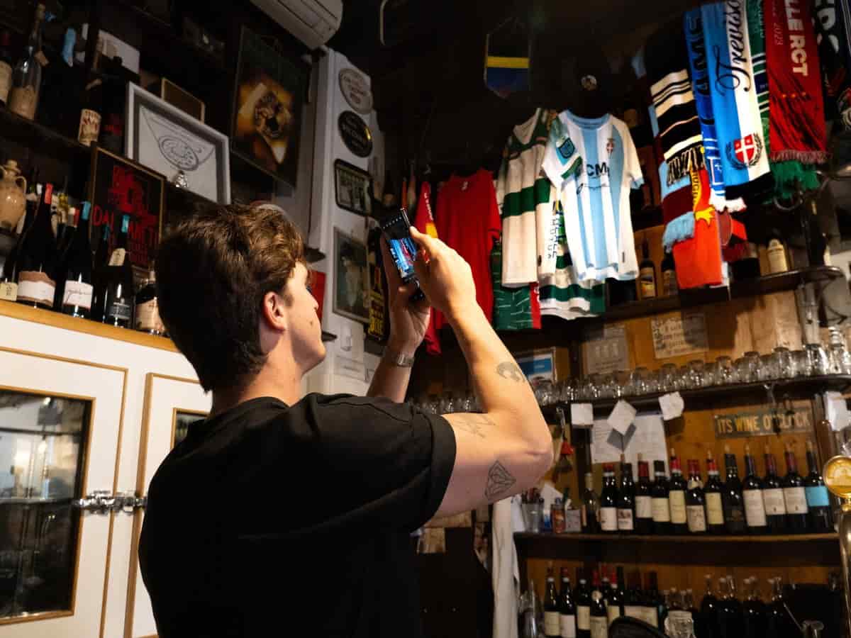 A fan capturing football memorabilia and club shirts