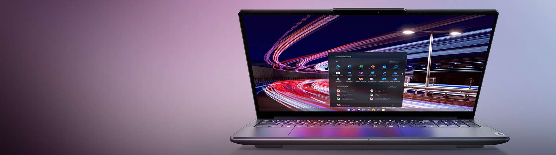 Lenovo Yoga Pro 9i laptop with a sleek, modern design displayed on a desk, featuring a large screen with thin bezels, showcasing the power and versatility of the device.