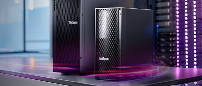 Two Lenovo ThinkSystem tower servers on a desk with a sleek metallic surface, surrounded by a dynamic purple and pink light trail, with a server rack visible in the background.