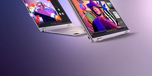 Two thin laptops in a floating, open position, each displaying colorful digital artwork on screen.
