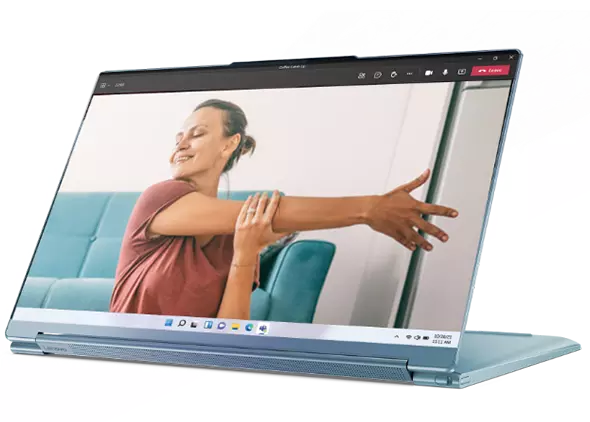 Lenovo Yoga 9i in presentation mode, showing a lady doing yoga at home.
