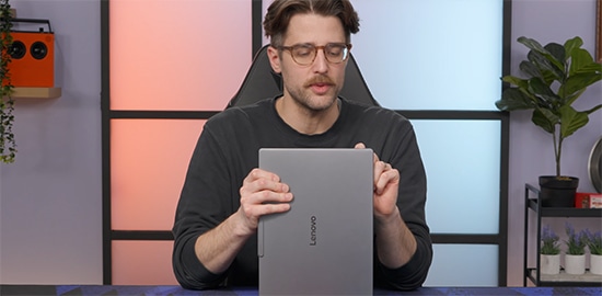 ShortCircuit holds a Yoga Slim 7i Ultra Aura Edition (14” Intel) laptop.