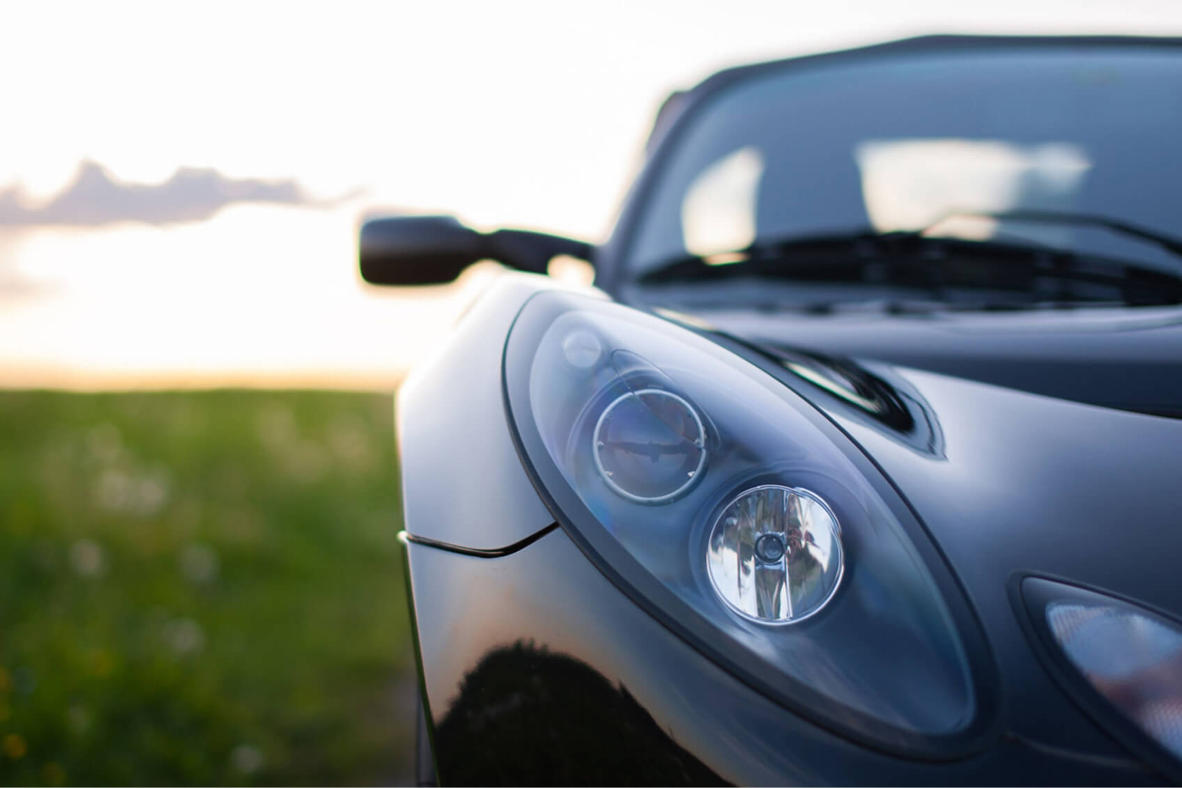 A Lotus vehicle on a rural road. 