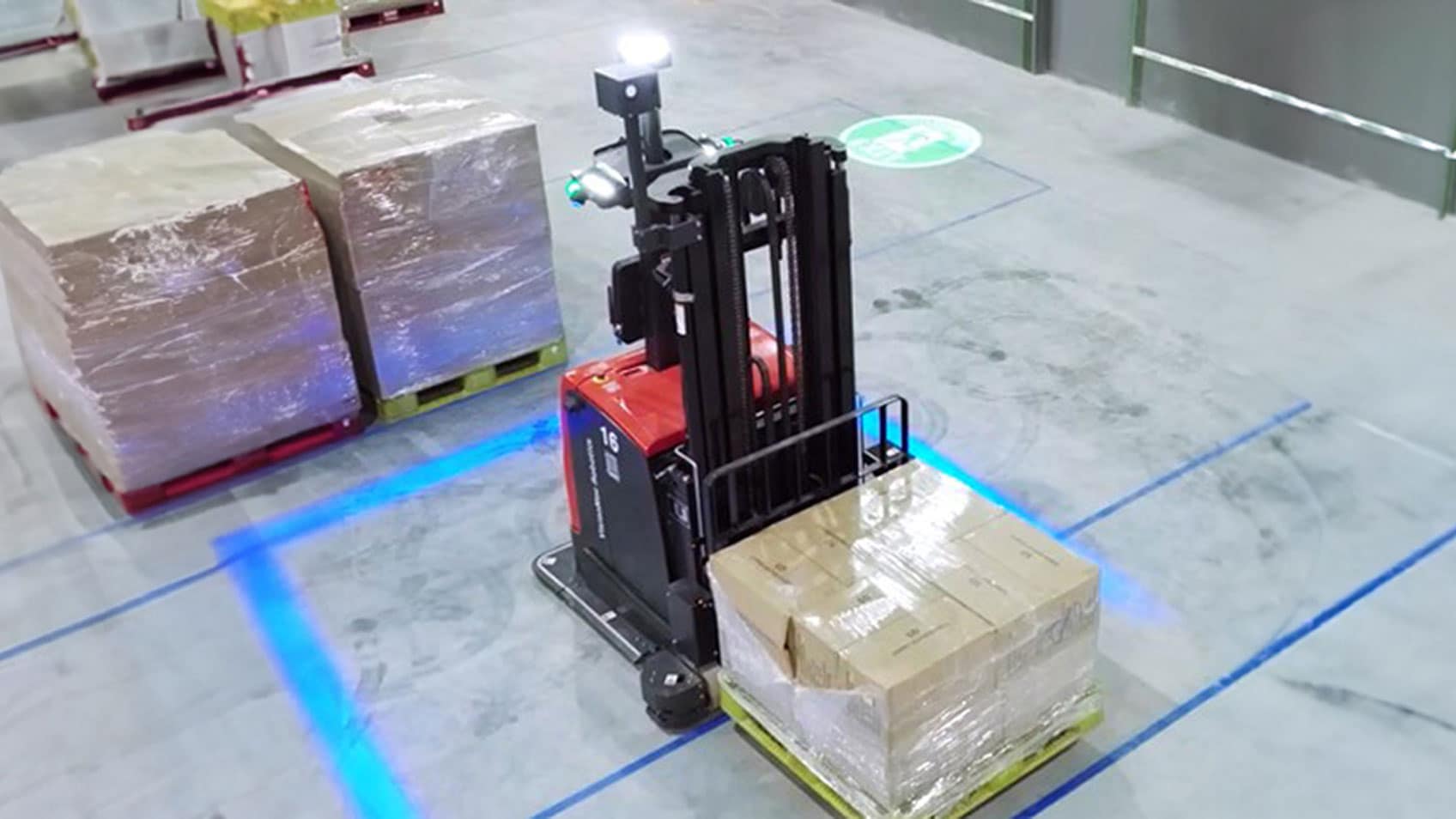 A forklift moving a palette. 