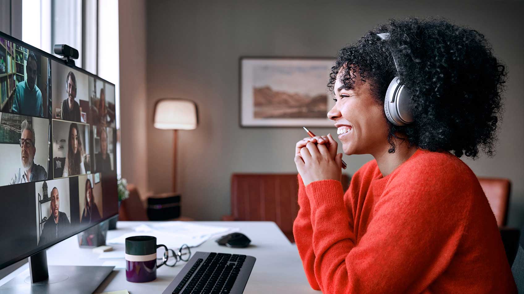 A woman working from home and participating in a video conference call