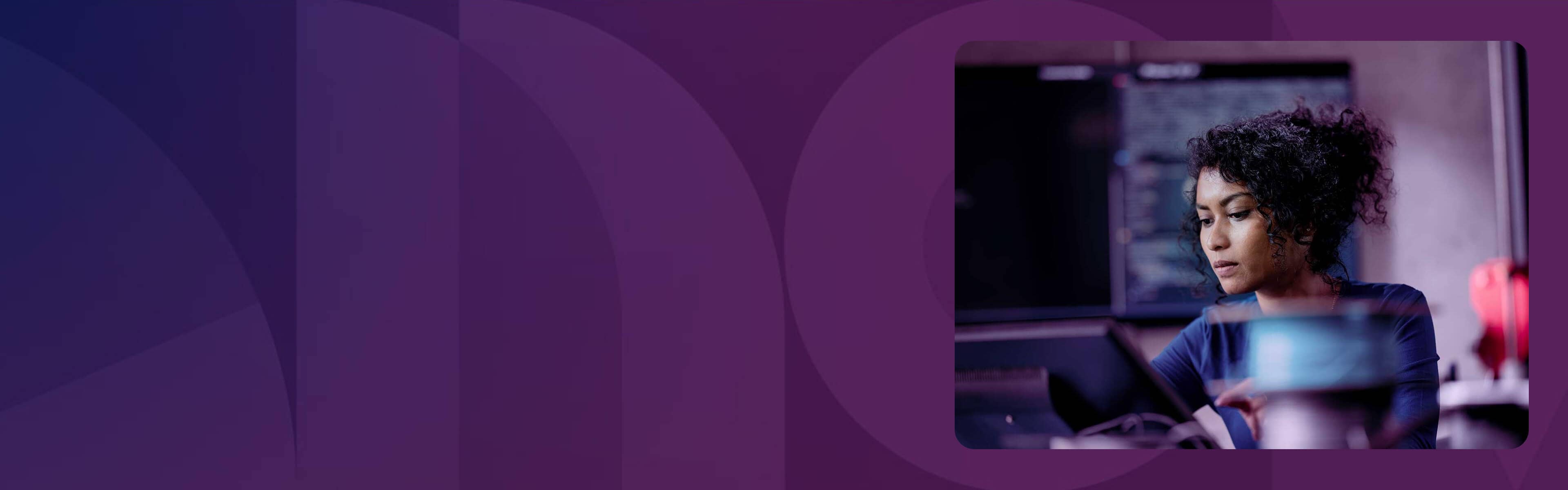 A woman working at her desk.