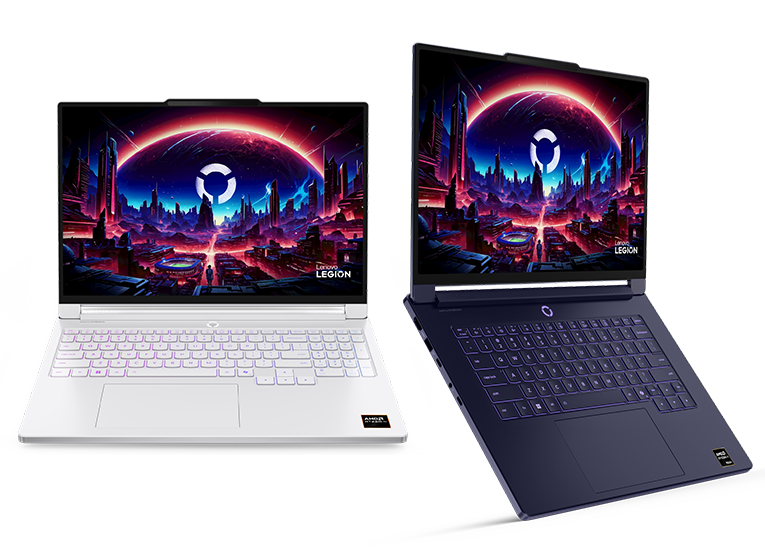 Two gaming laptops with RGB keyboards side by side; screens show sci-fi city art, Lenovo Legion laptops.
