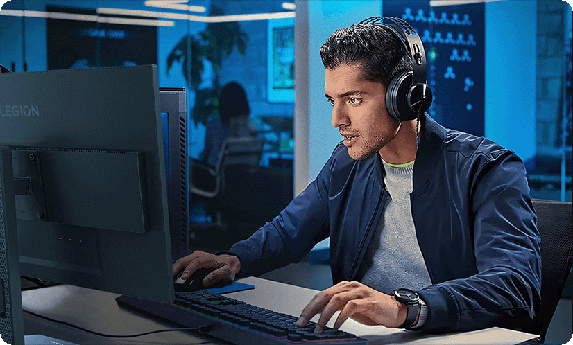 A lifestyle picture shows a man using the Legion-25q-10 monitor which  has EyeSafe 2.0 Certification by TÜV Rheinland.