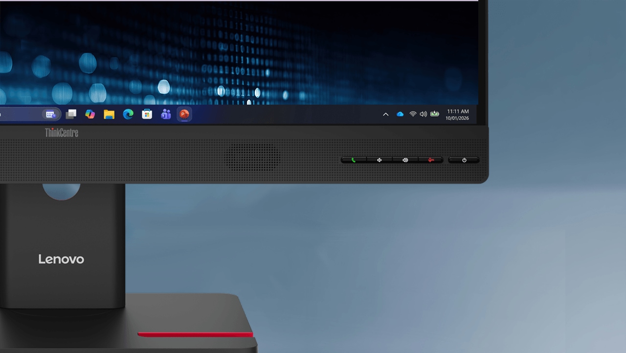 Close-up of a ThinkCentre TIO27 Gen6 monitor with integrated speaker grille, audio controls, and Windows desktop display.