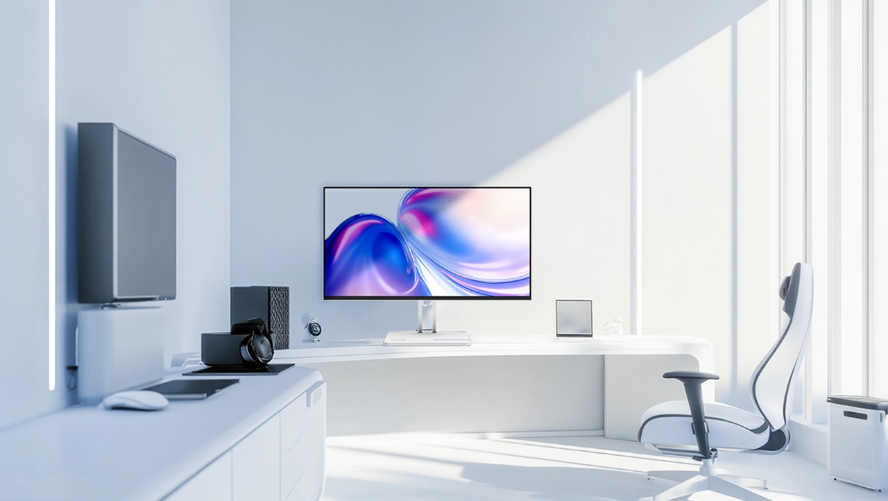 A modern, clean room with gray and white tones displays the 6.9mm ultra-thin L24-4C monitor.