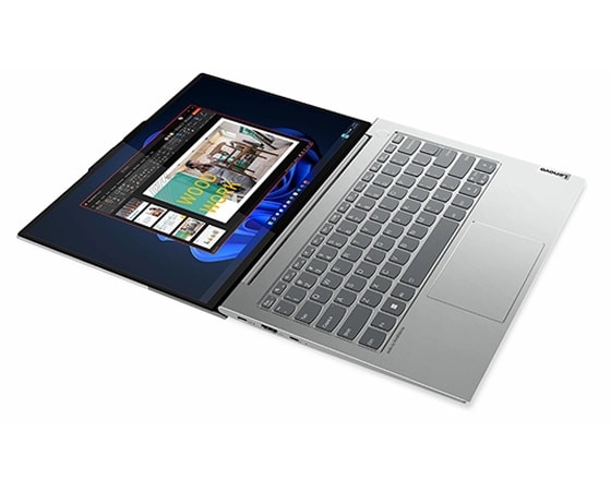 The ThinkBook 13s Gen 4 (Intel) laptop, viewed from the left and open 180° as if laying flat on a table, highlighting its modern, lay-flat hinge and left-side ports.