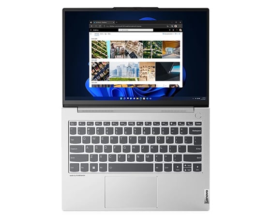 Den bärbara datorn Lenovo ThinkBook 13s Gen 4 visad ovanifrån, öppnad i 180 grader så att tangentbordet och skärmen i färgen Cloud Grey visas.