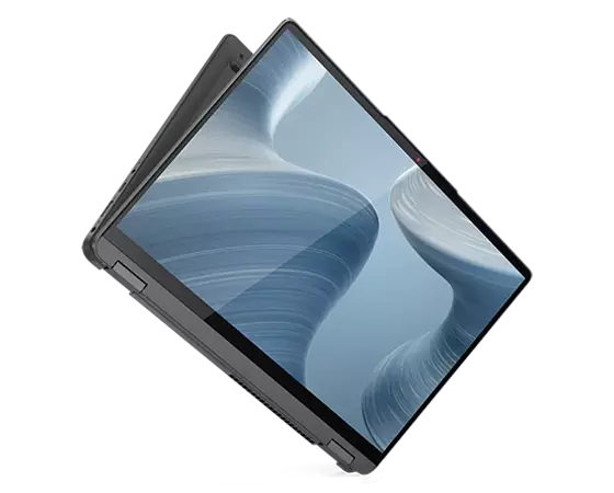 The 14” IdeaPad Flex 5i, suspended at an angle, slightly opened from tablet mode, showing the display, with a swirling grey background, and part of the bottom of the device