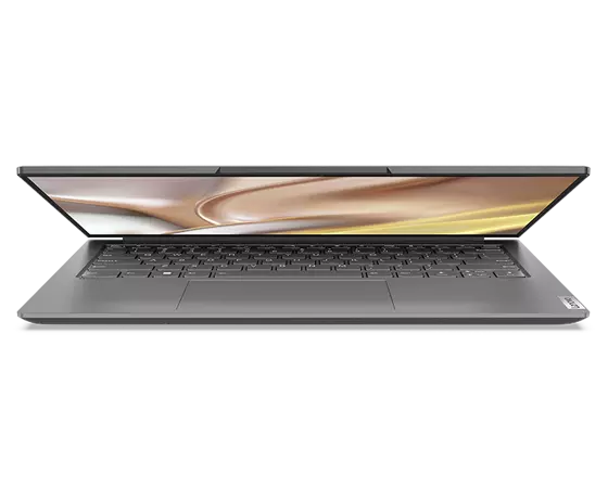Vooraanzicht van Yoga Slim 7 Pro Gen 7 (14" AMD) laptop, deels geopend, met toetsenbord en scherm met gele, bruine en witte wervelingen