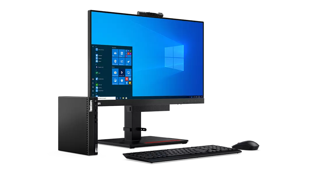 Lenovo ThinkCentre M75q Gen 2 placed next to to monitor, keyboard and mouse; left side view