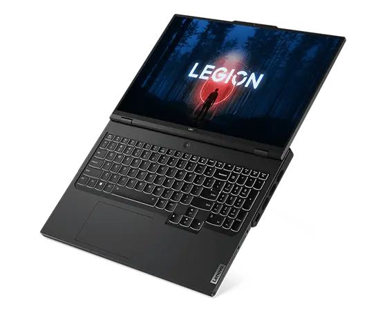 Lenovo Legion Pro 7 Gen 8 (16" AMD) Gaming-Notebook, Ansicht von oben rechts, flach liegend, um 180 Grad geöffnet, mit Blick auf das Display mit Legion Logo und Startbildschirm, die Tastatur und die Anschlüsse auf der rechten Seite