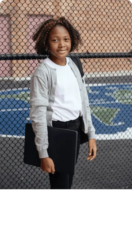 child holding laptop