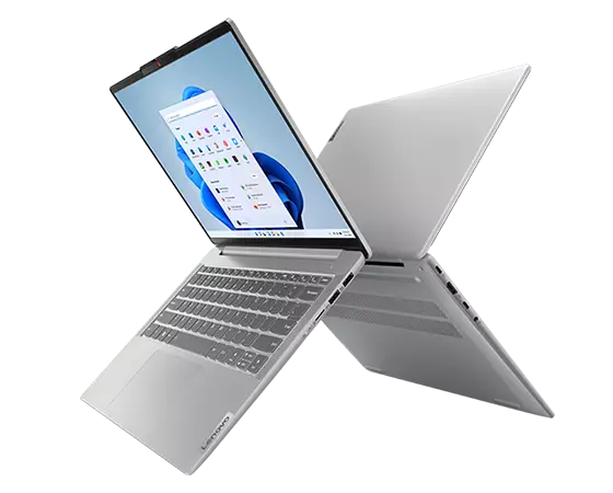 Back-to-back 14-inch Lenovo IdeaPad Slim 5 AMD laptops open 90 degrees and forming an ‘X’ with keyboard and display showing on front facing device.