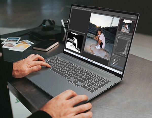 A pair of hands works on the IdeaPad Pro 5 Gen 8 (16
