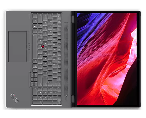 Vista aérea do portátil Lenovo ThinkPad P16 (2.ª geração) de 16" (40,64 cm, Intel), totalmente aberto a 180 graus, a mostrar o ecrã com desenhos em espiral no ecrã, bem como o teclado